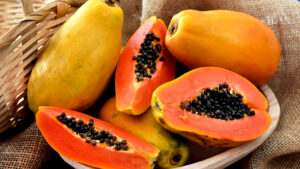 Papaya fruits, some cut open