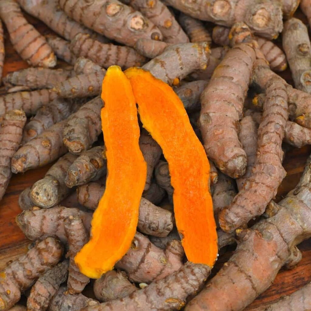 turmeric roots, one cut open